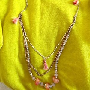 Gold chain necklace with triple dangle.